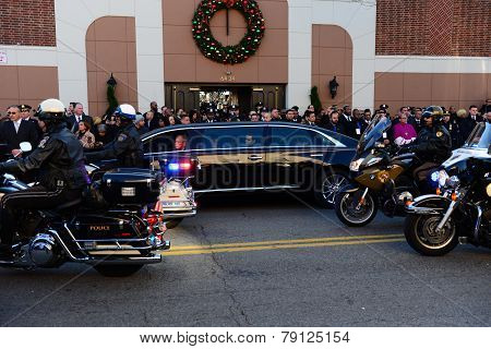 Motor police procession past limosine
