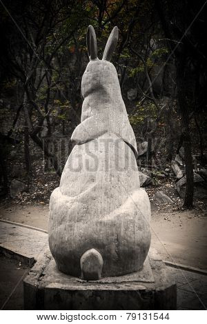 statue of the back of a giant rabbit in a national park
