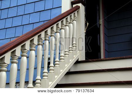 Staircase and railing leading to home's front door