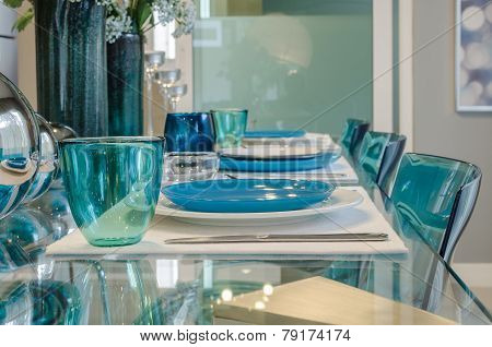 Table Set On Glass Table In Dinning Room