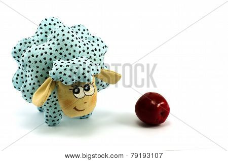 Rag-doll turquoise lamb with red apple