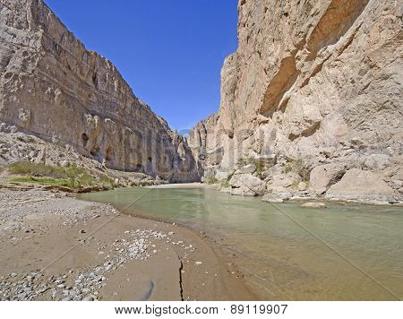Desert River Entering A Remote Canyon
