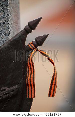 Ribbon of Saint George at the Soviet War Memorial with graves of Soviet soldiers fallen in the last days of World War II at the Olsany Cemetery in Prague, Czech Republic.