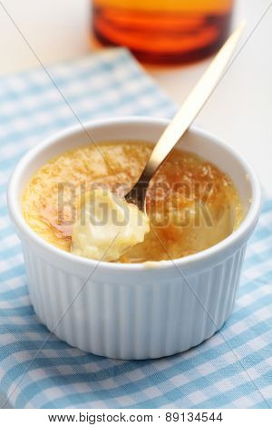 Eaten creme brulee in a ramekin closeup