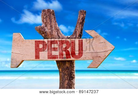 Peru wooden sign with beach background