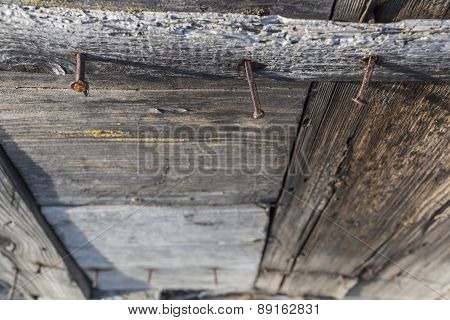 Rusty Nails In Wooden Wall