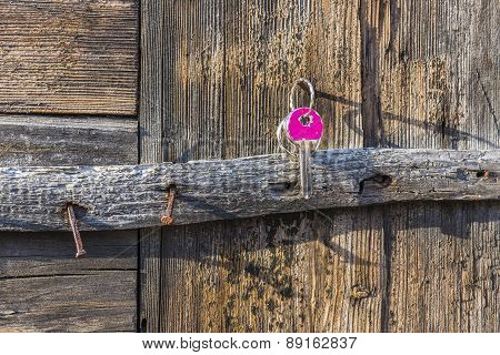 Key Hanging On Old Rustic Nail