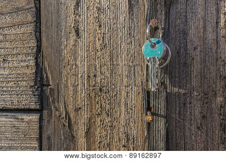Key Hanging On Old Rustic Nail