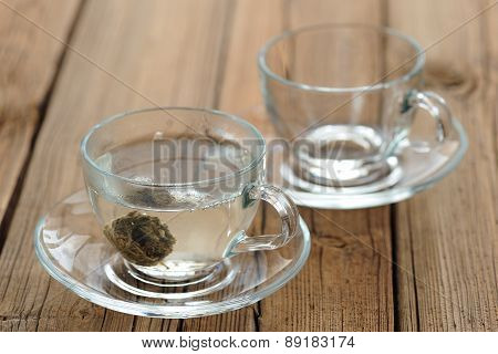 Pressed Green Puerh Tea Brewed In Glass Teacup