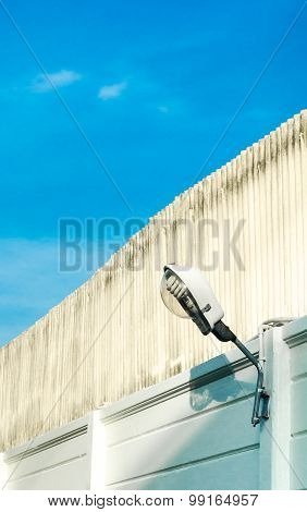 Street Wall Lamp At Cement Fence