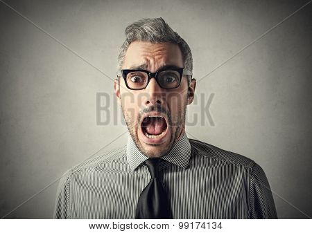 Shocked spellbound businessman