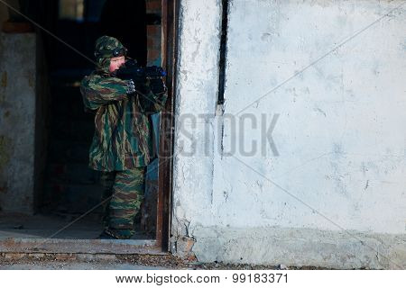 boys playing with gun during laser tag