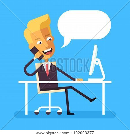 Handsome blonde manager in formal suit sitting legs crossed at the desk with a computer and talking