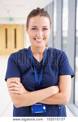Portrait Of Female Nurse Standing In Hospital Corridor