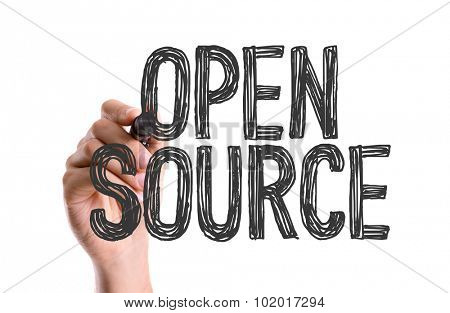 Hand with marker writing: Open Source