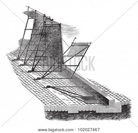Old engraved illustration of needle dam design. Industrial encyclopedia E.-O. Lami - 1875.