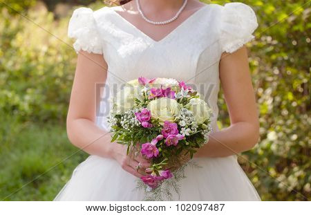 Bride, bouquet and wedding dress