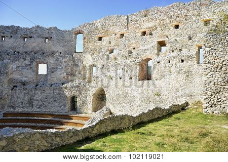 The ruins of the castle. Window on old castle in the rocks Podhradie, Topolcany, Slovakia