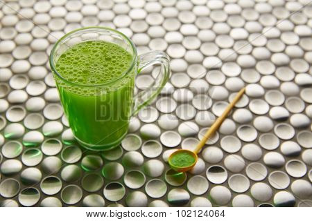 Matcha green tea from Japan on modern stainless steel background