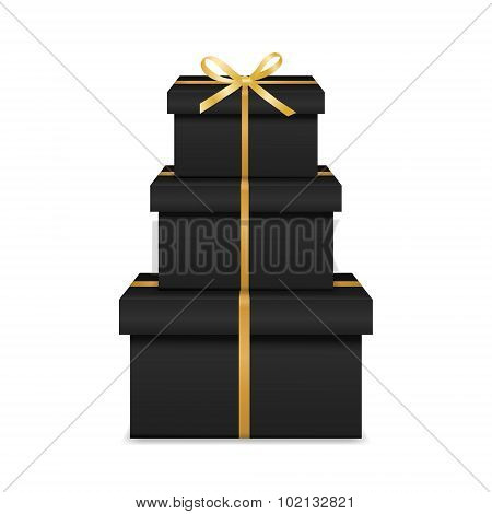 Stack of three realistic black gift boxes with golden ribbon and bow