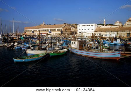 Fishing boats mooring at ancient Yaffo Port Israel in Tel Aviv Israel.