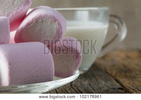 Pink Marshmallow With Milk On Wooden Table