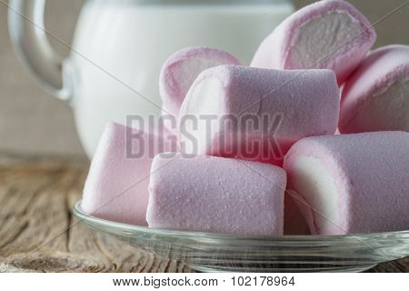 Pink Marshmallow With Milk On Wooden Table
