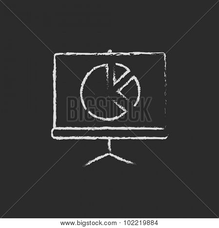 Roller screen with the pie chart hand drawn in chalk on a blackboard vector white icon isolated on a black background.