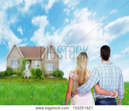 Young loving couple looking at new home. Mortgage.