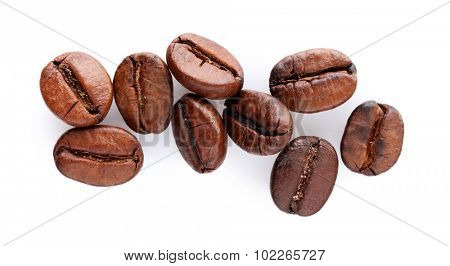 Brown coffee beans isolated on white