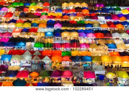 Blurred bokeh lights of aerial view colors flea market
