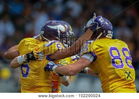 VIENNA, AUSTRIA - JUNE 22, 2014: WR Laurinho Walch (#6 Vikings) and his team mates celebrate a touchdown.