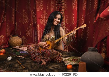 Beautiful Woman Playing The Dombra