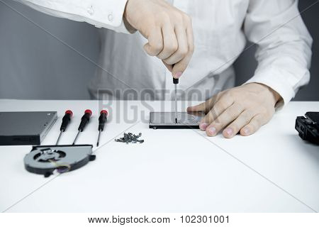 Man Repair Laptop