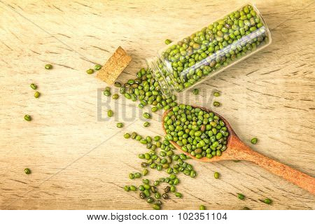 Close Up Green Mung Beans In Wooden Spoon On Wood Plate