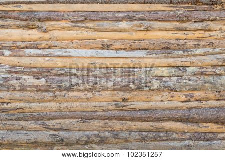 Fence  hastily put together  from horizontal  flitch