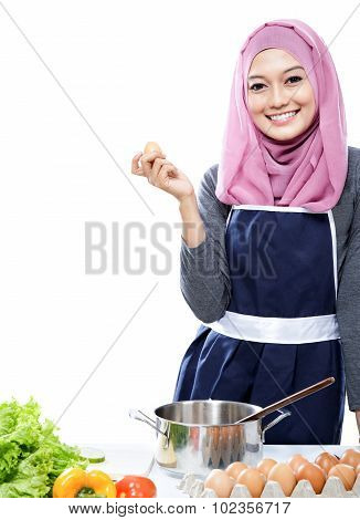Young Woman Preparing Making A Meal With Ingredients On The Table