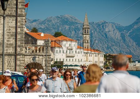 PERAST, MONTENEGRO - JULY 20, 2015: Tourists walk in the historical city of Perast on July 20th, 201