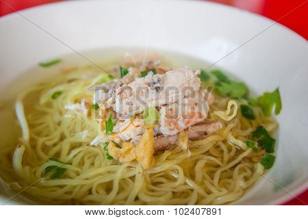 Chinese Egg Noodles With Crab Meat In Hot Soup.