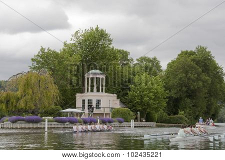 HENLEY, ENGLAND. 02-07-2010. Rowers race past Temple Island  on day 3 of the Henley Royal Regatta 2010 held on the River Thames.  