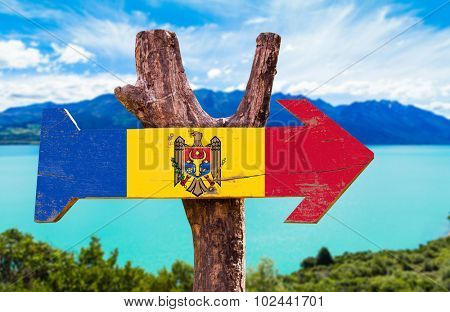 Moldova Flag wooden sign with lake background