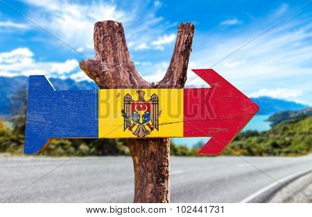 Moldova Flag wooden sign with road background