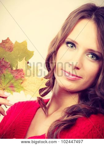 Pretty Autumnal Girl With Maple Leaves In Hand