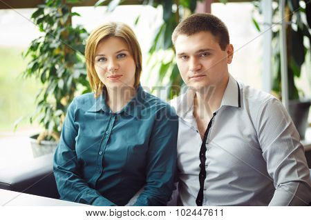 Couple Sitting In Cafe