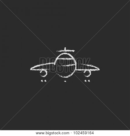 Airplane hand drawn in chalk on a blackboard vector white icon isolated on a black background.