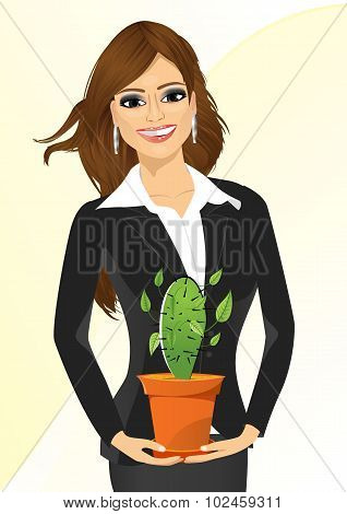 business woman holding cactus