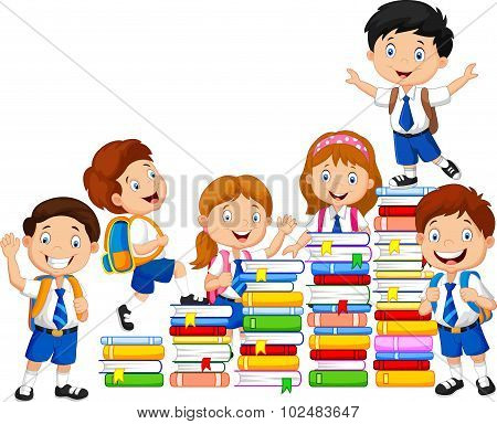 Happy schoolkids playing with stack of books