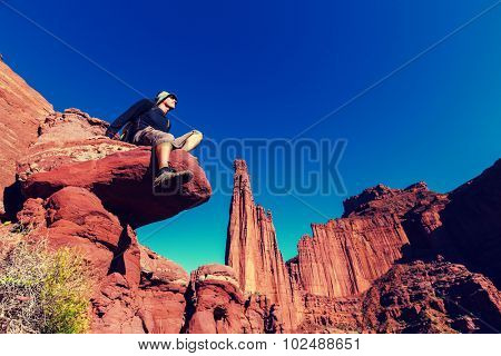 Hike in Utah formations.Man on the cliff. Instagram filter.