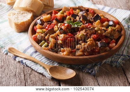 Italian Appetizer Caponata Close-up On A Wooden Plate. Horizontal