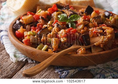 Sicilian Caponata With Aubergines Closeup On Wooden Plate. Horizontal